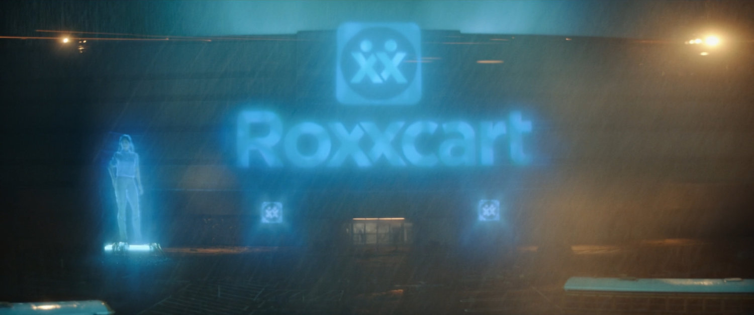 Rainy night exterior of Roxxcart store.