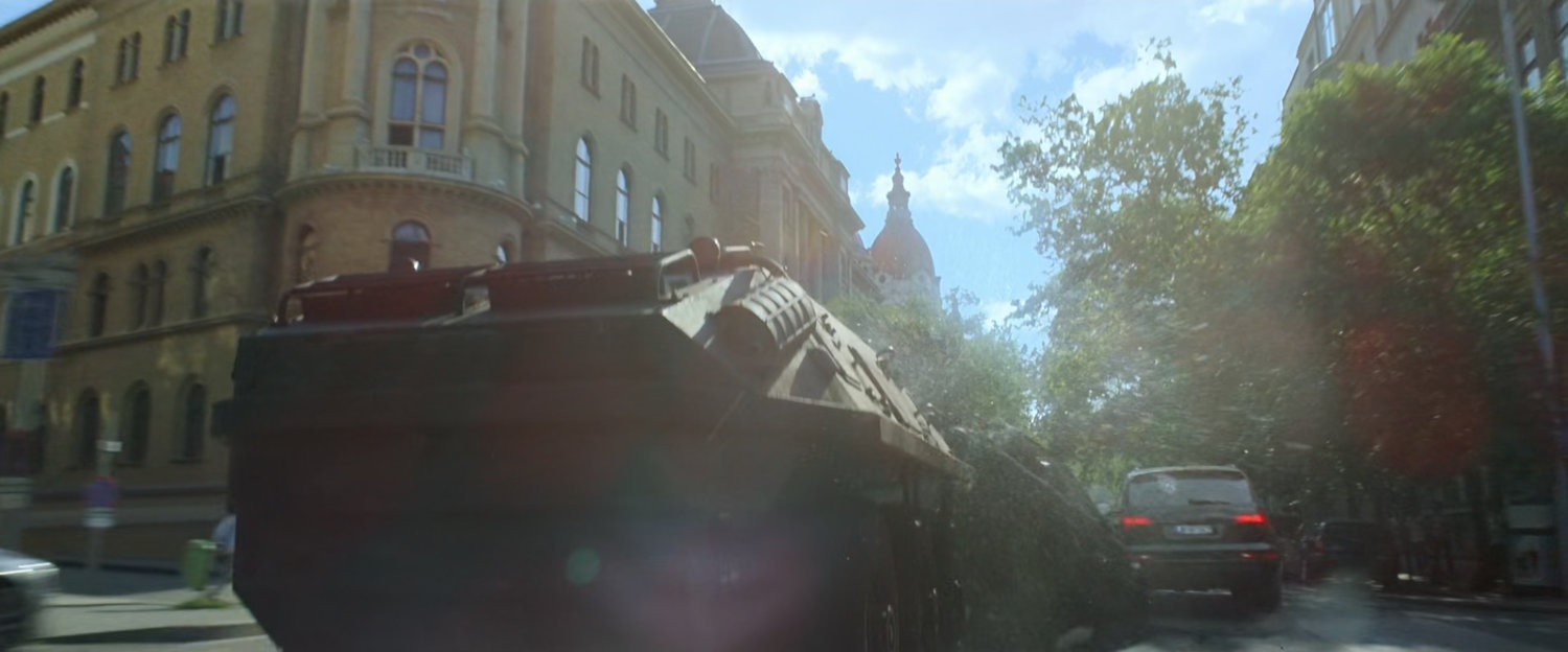 An APC crashes through cars on a Budapest street.