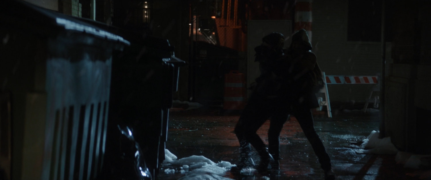 Clint hustles Kate into a dark alley.
