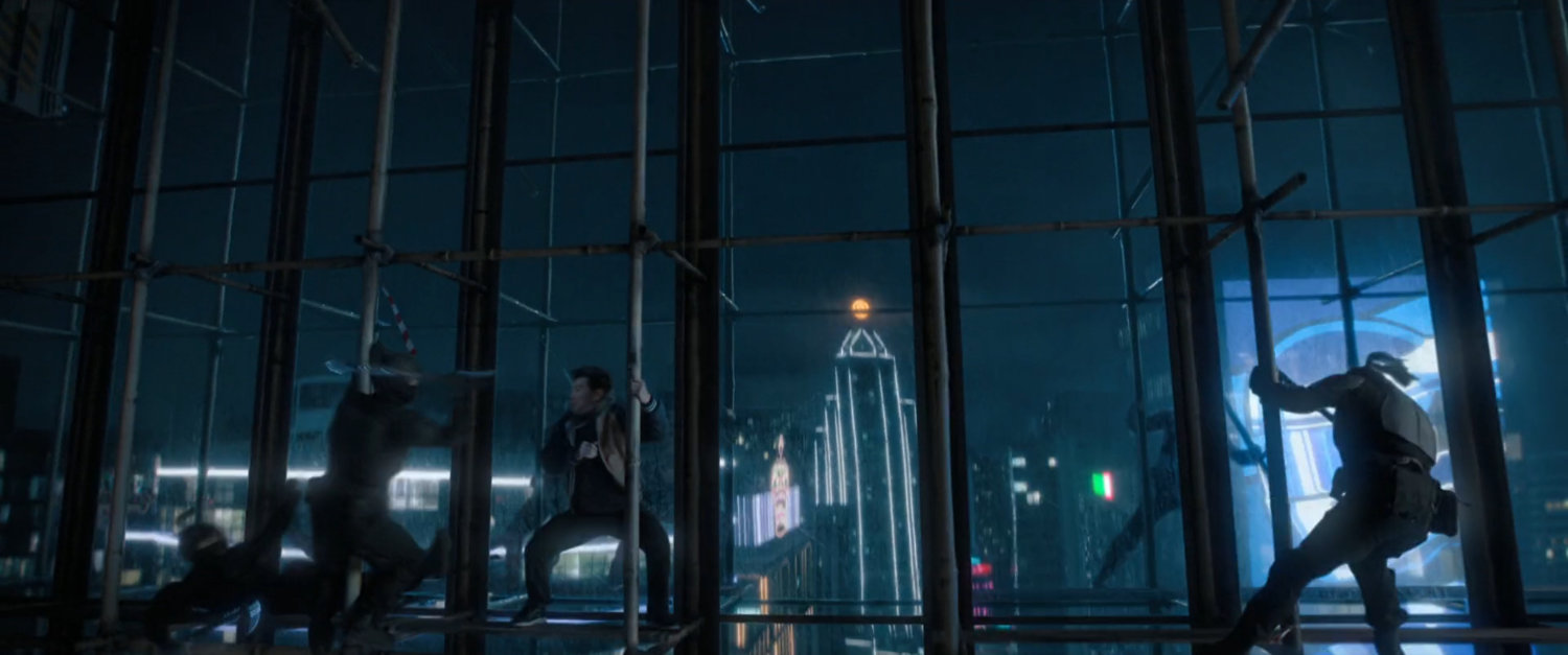 Shaun fighting bad guys on skyscraper scaffolding in Macau.