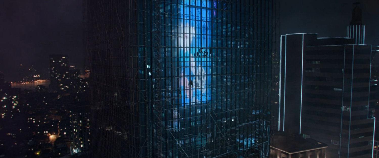Nighttime view of reflective skyscraper in Macau.