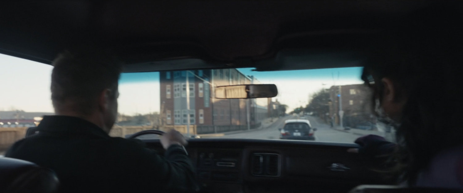 View of car chase from inside car.