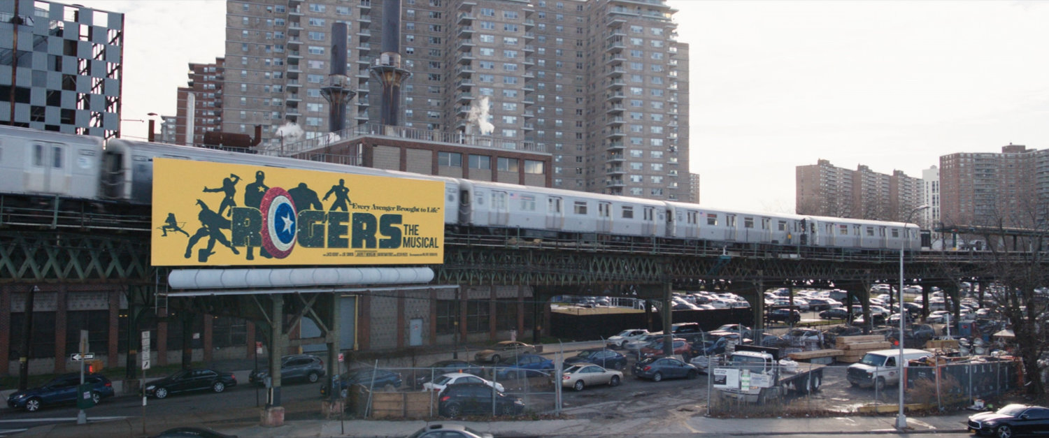 Elevated train track with Rogers: The Musical billboard.