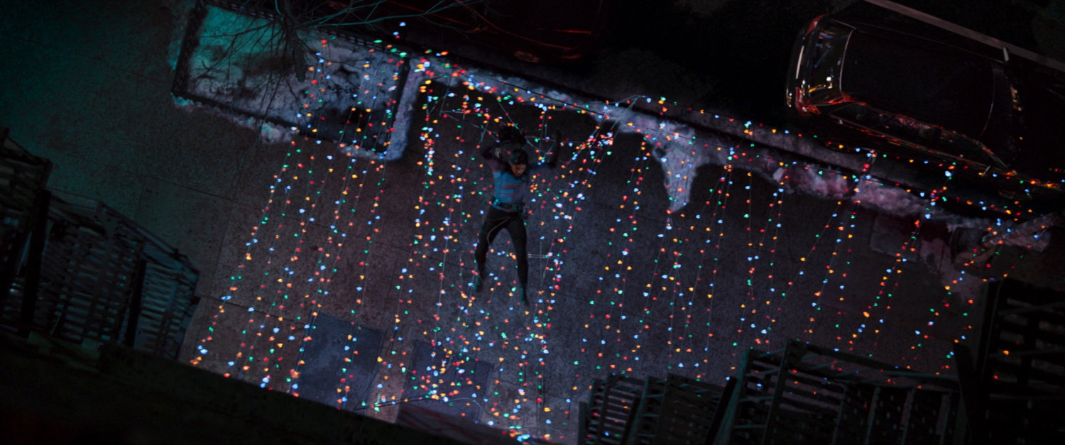 Kate falls into Christmas light decorations.