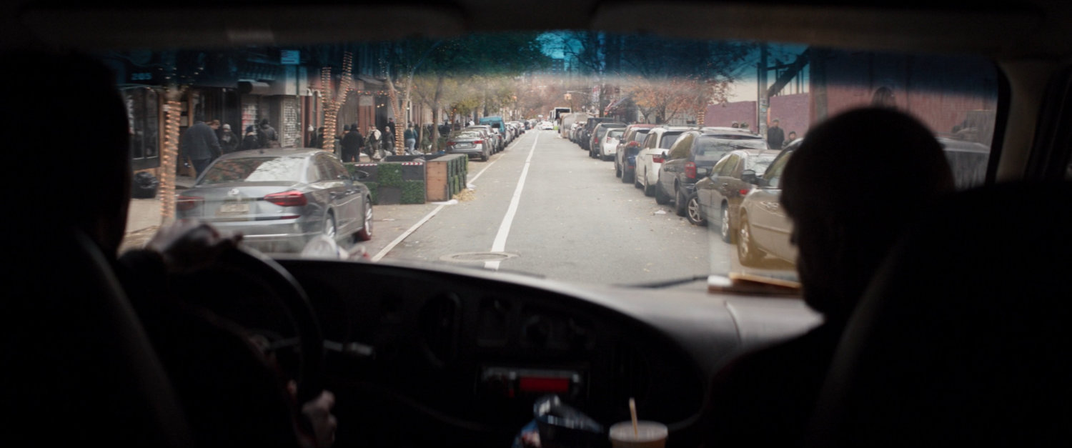 View from inside Trust-A-Bro van driving on New York street.