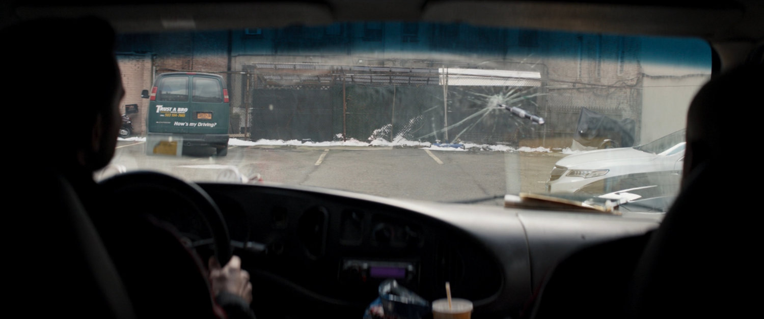 View from inside Trust-A-Bro van in New York parking lot.