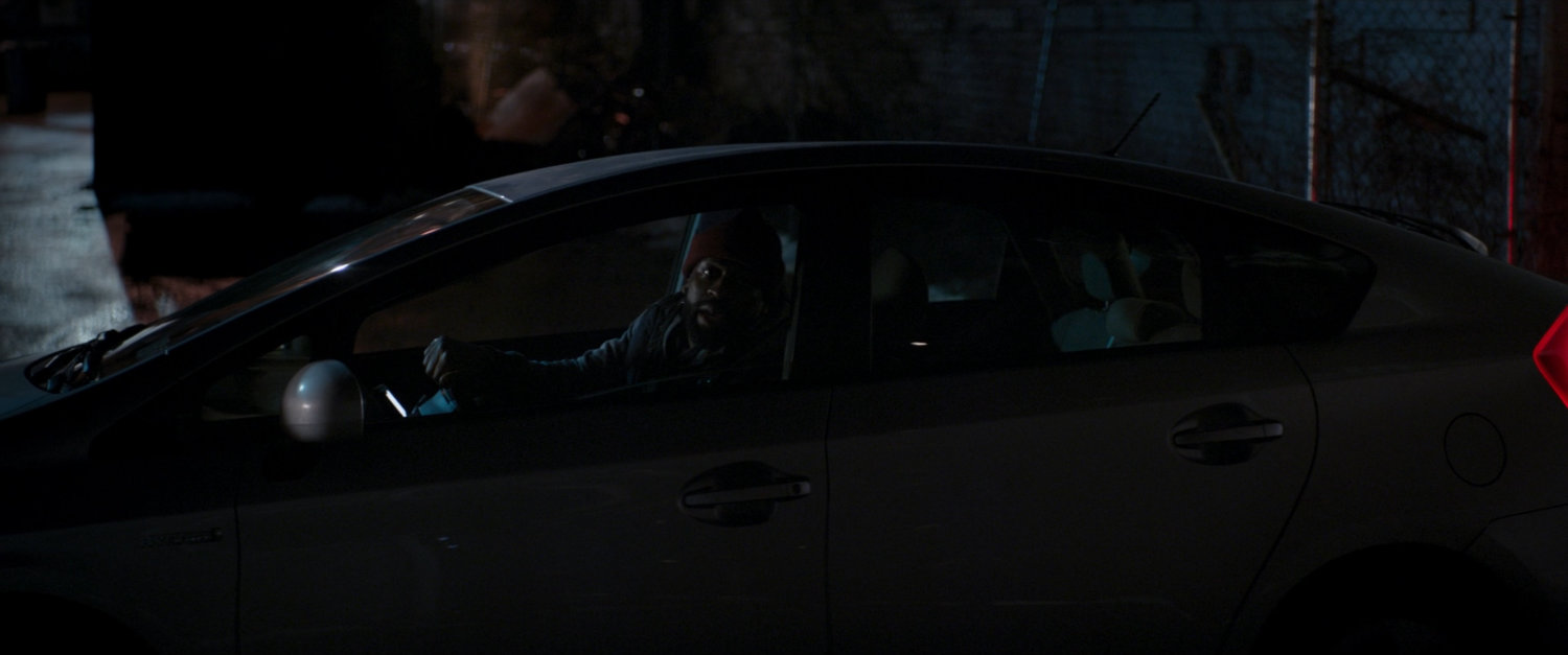 A car picks up Clint and Kate in a very dark alley.