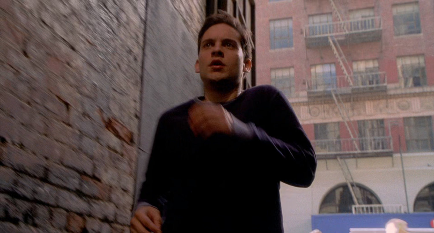 Peter Parker runs into alley.