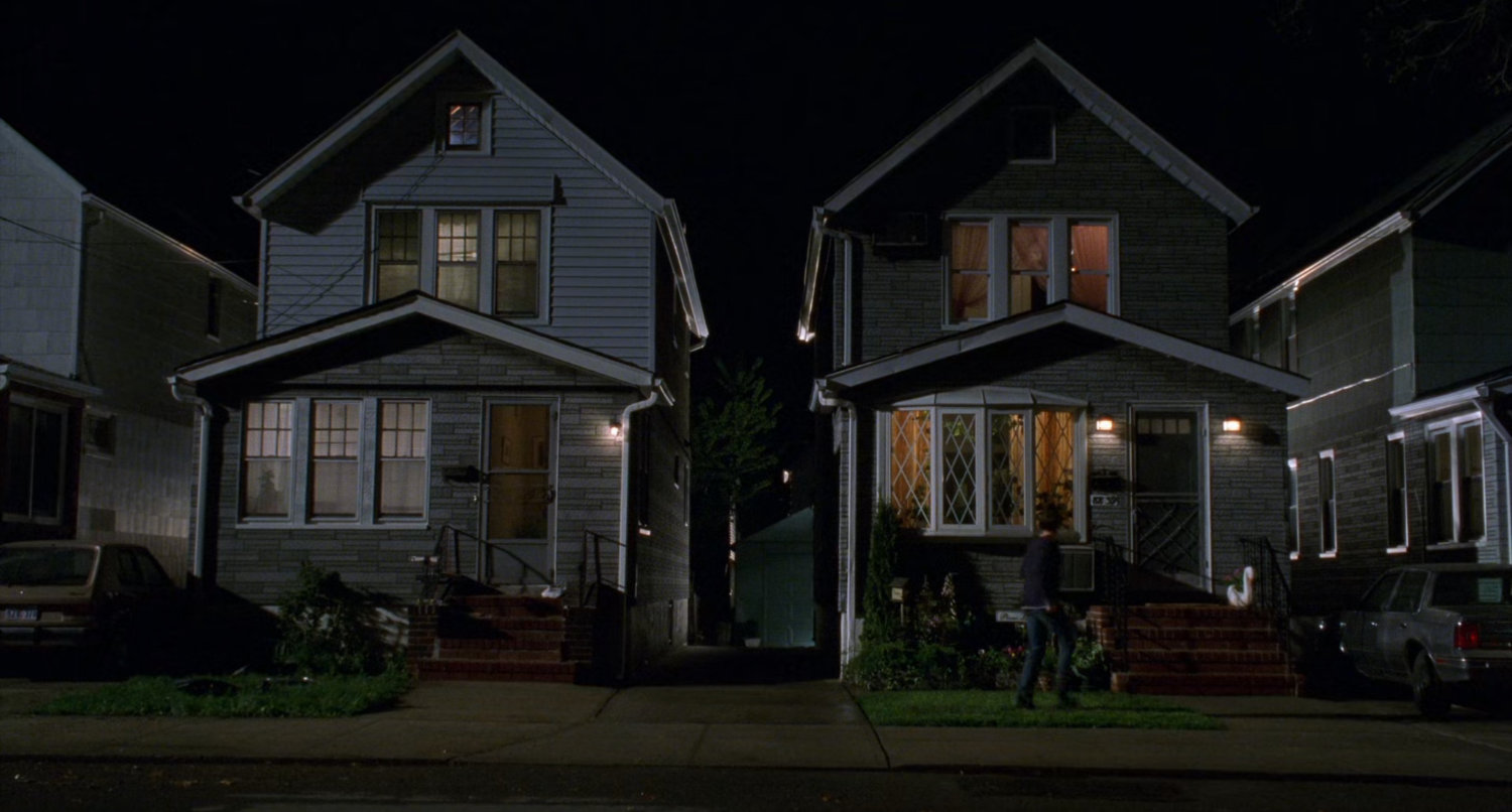 Exterior of Mary Jane and parker homes at night.