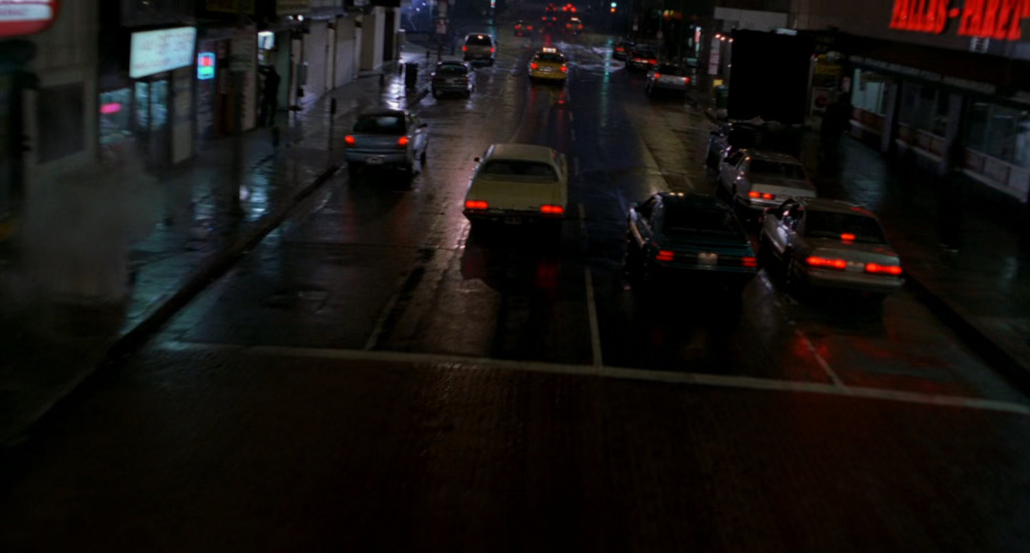Night street car chase.
