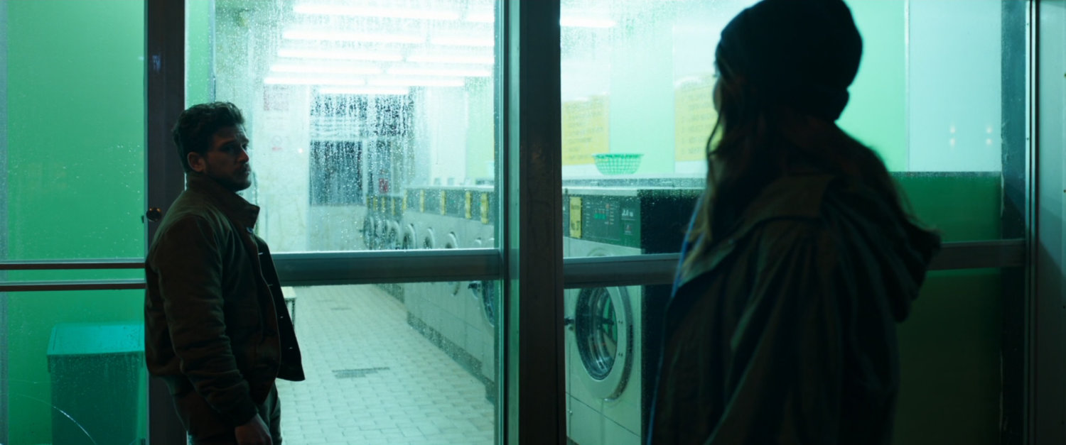 Sersi and Dane in front of laundromat.