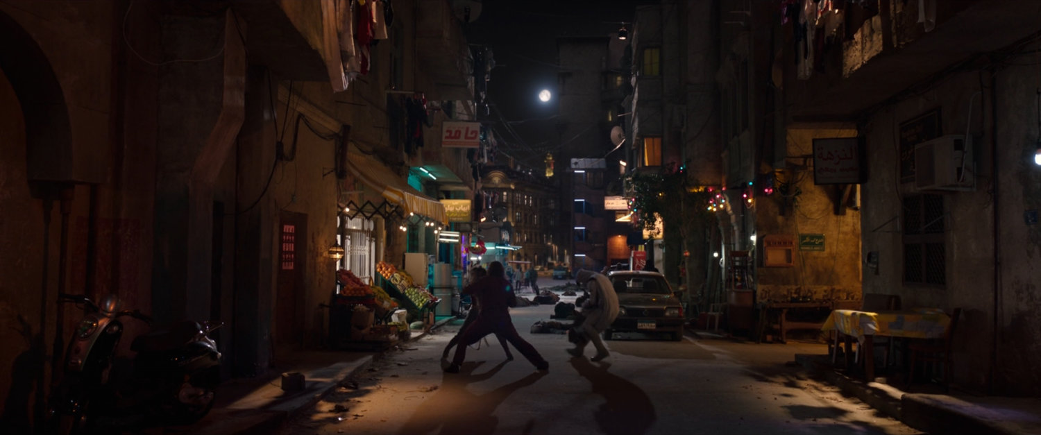 Moon Knight fighting bad guys in Cairo marketplace.