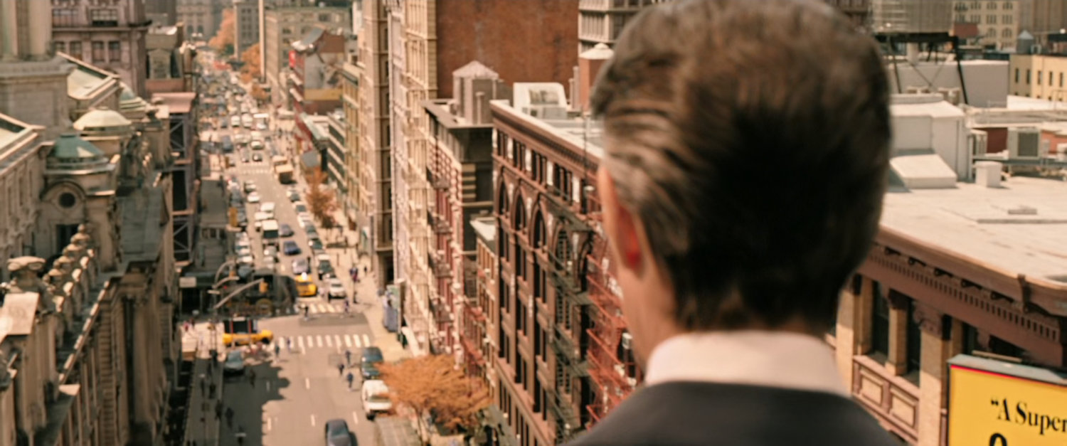 Dr Strange looks down on Soho street in New York City.