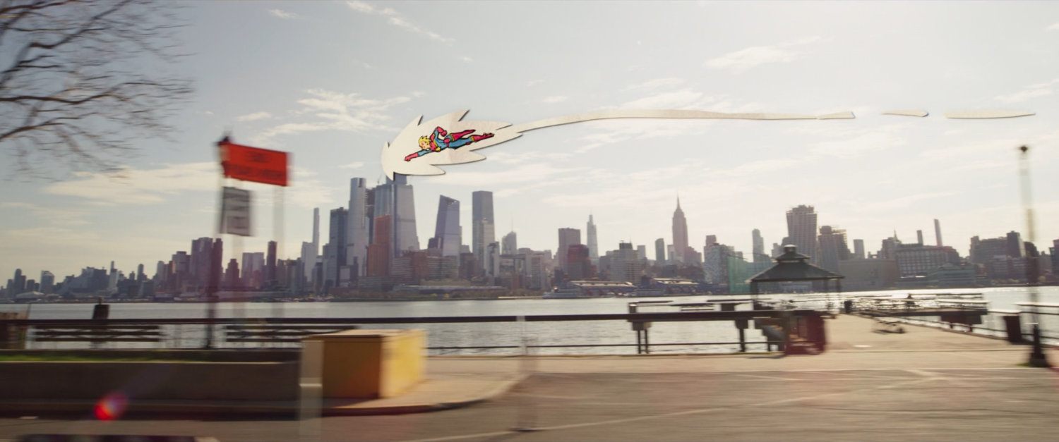 Animated Captain Marvel flying along the side of a Jersey City road.