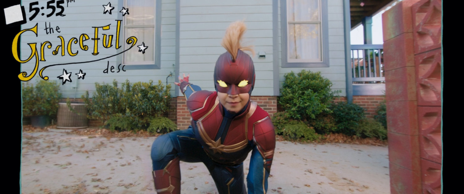 Kamala strikes a superhero pose outside the Khan house.