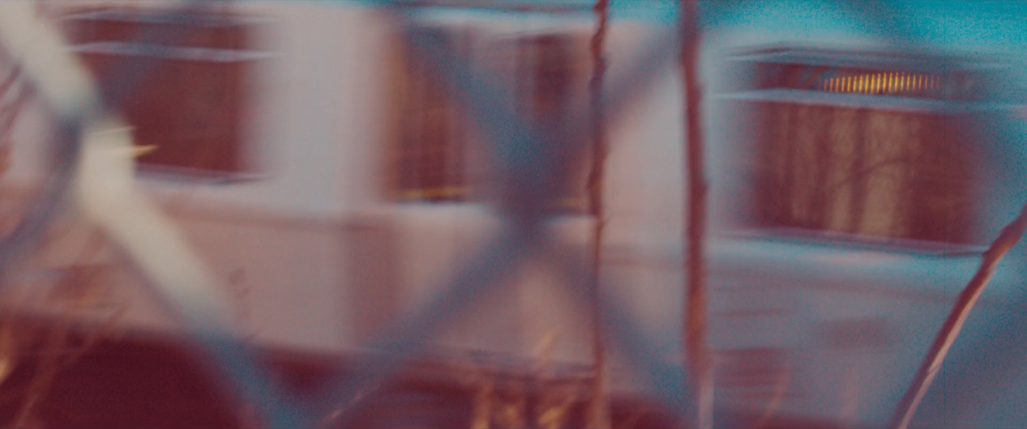 Ms Marvel end credit screen: Blurry Train through Chain Link Fence