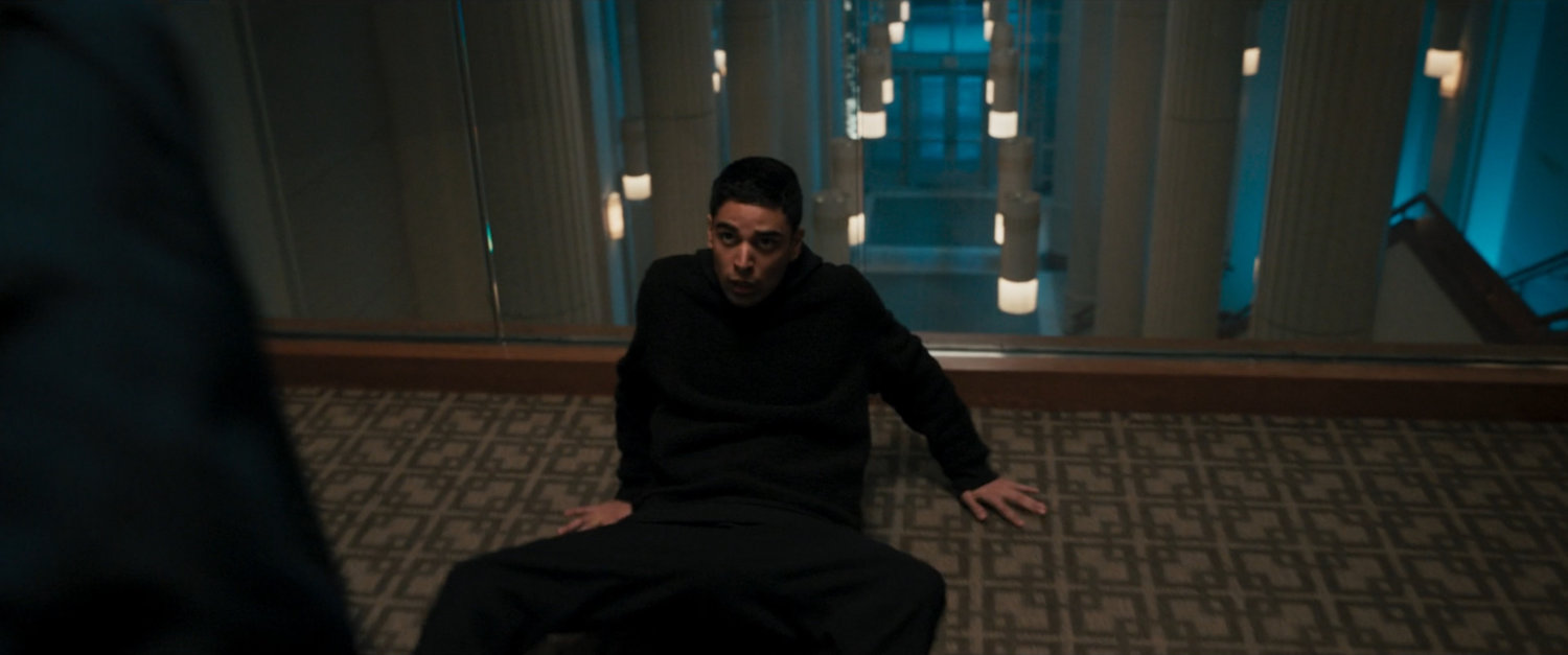 Kamran in upper hallway of lobby in wedding reception venue.