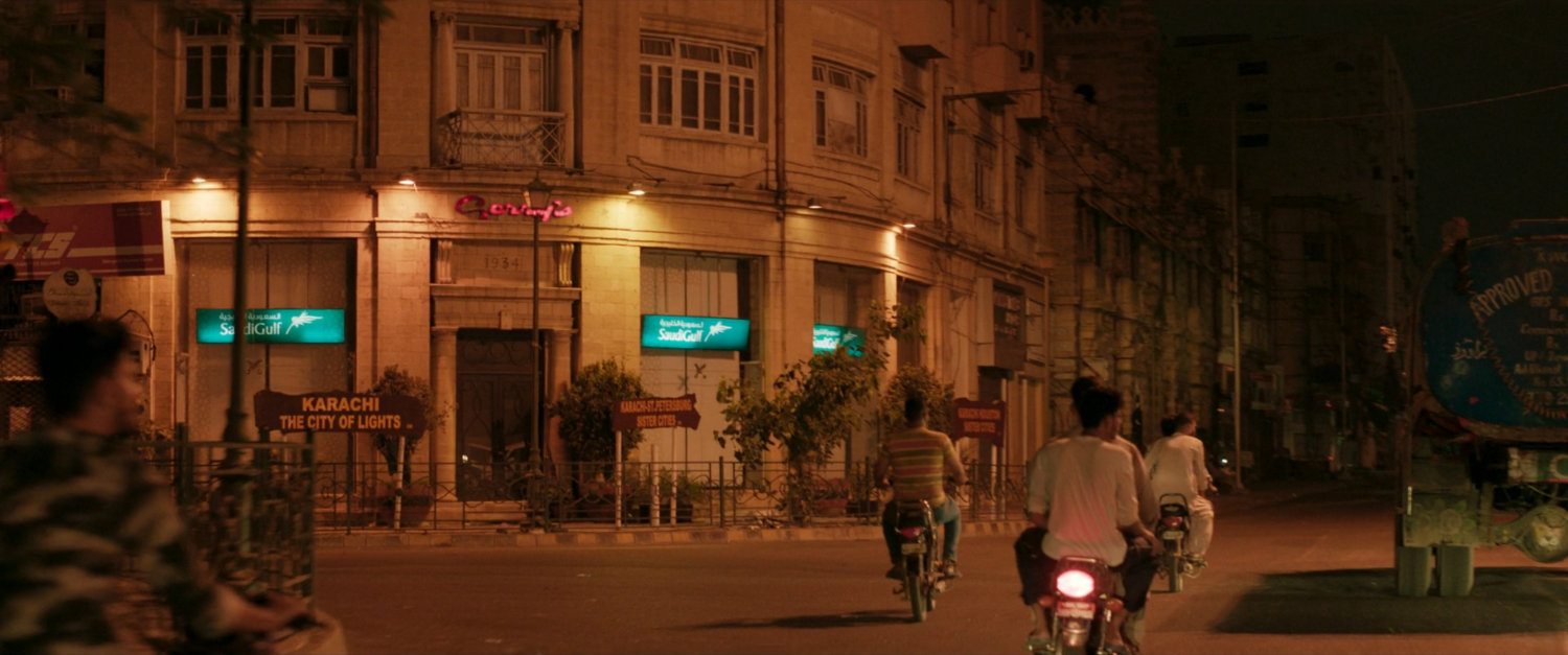 Nighttime view of Karachi street corner.