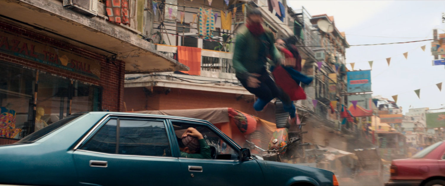 Kareem and Kamala flip through the air in Karachi marketplace.