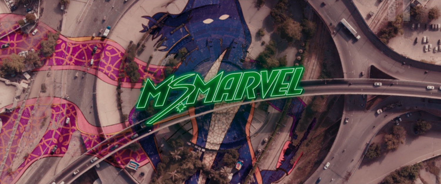 Ms Marvel end credit screen: Aerial Plaza (Text: Ms Marvel Title Card)