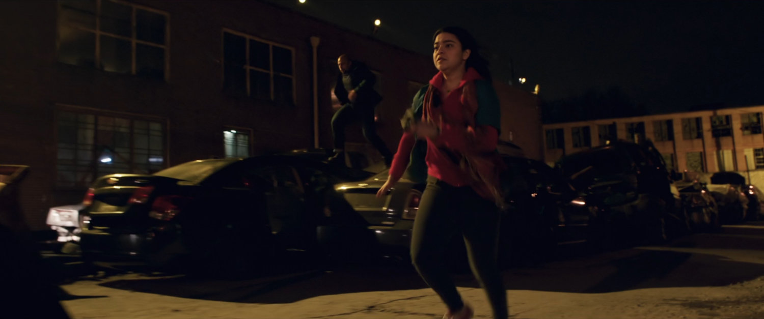 Kamela chased by Saleem in parking lot.