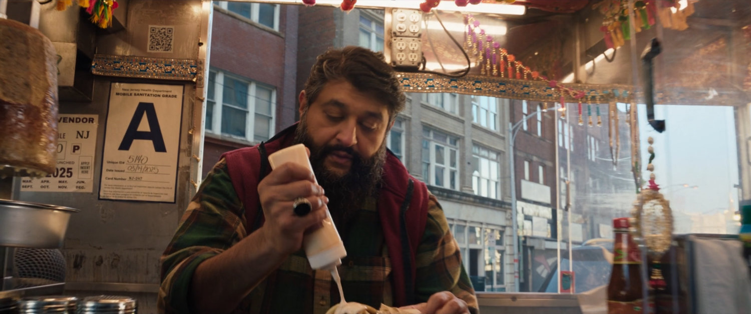 Najaf making gyros at his food truck.