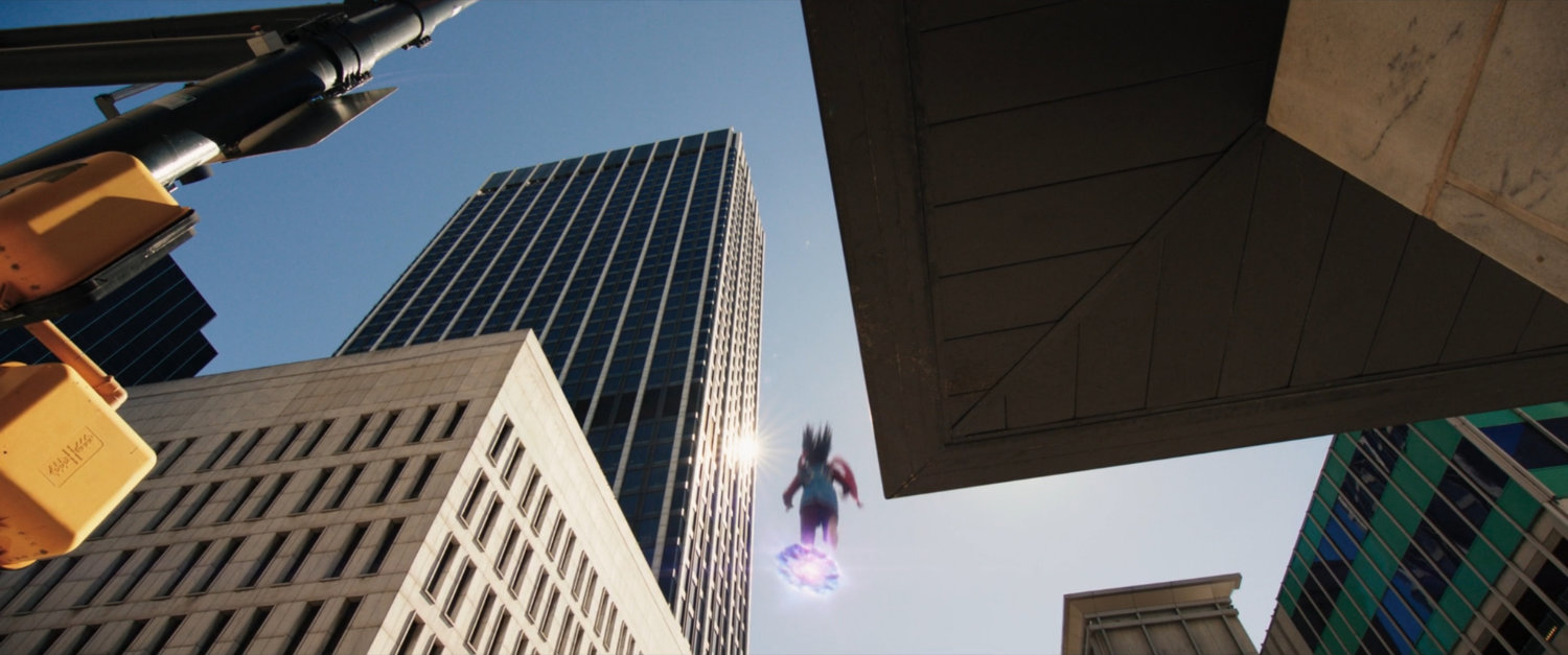 Ms Marvel runs through the city above the ground on platforms of hard light.