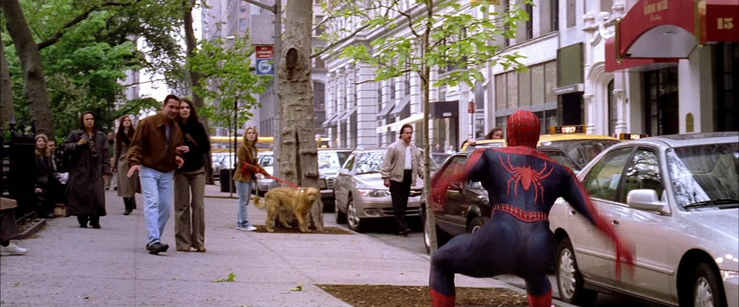 Spider-Man on sidewalk.