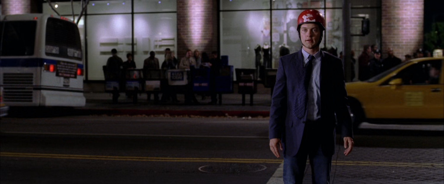 Peter Parker on street at night.