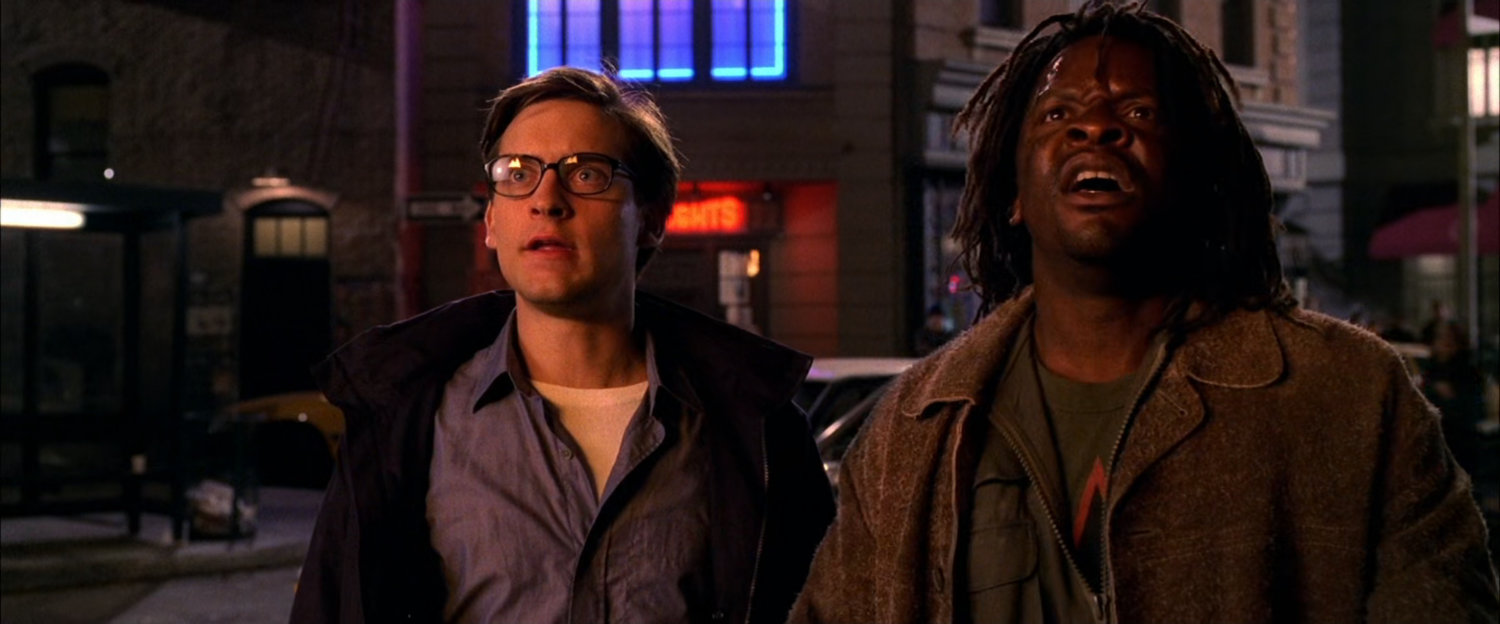 Peter Parker and onlooker witness apartment fire.