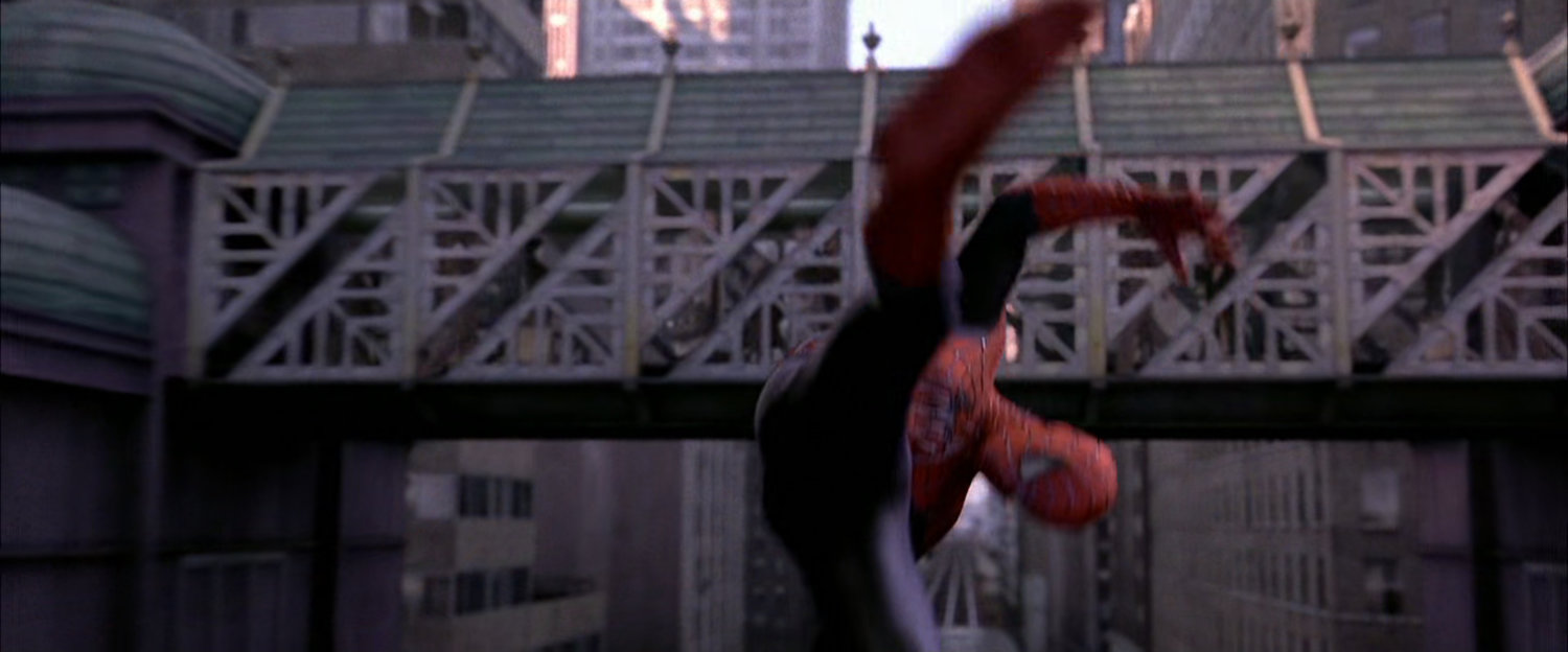 Spider-Man diving under bridge on speeding train.