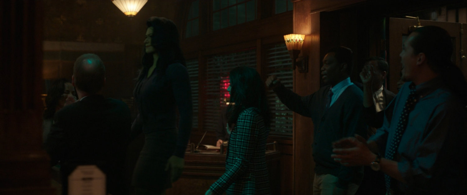 She-Hulk enters the Legal Ease Bar & Grill as customers chant her name.