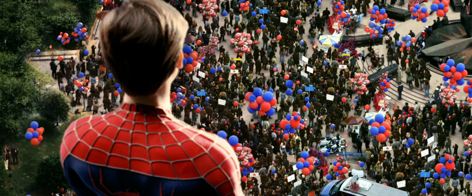 Spider-Man observes crowds gathered for Spider-Man Day event.