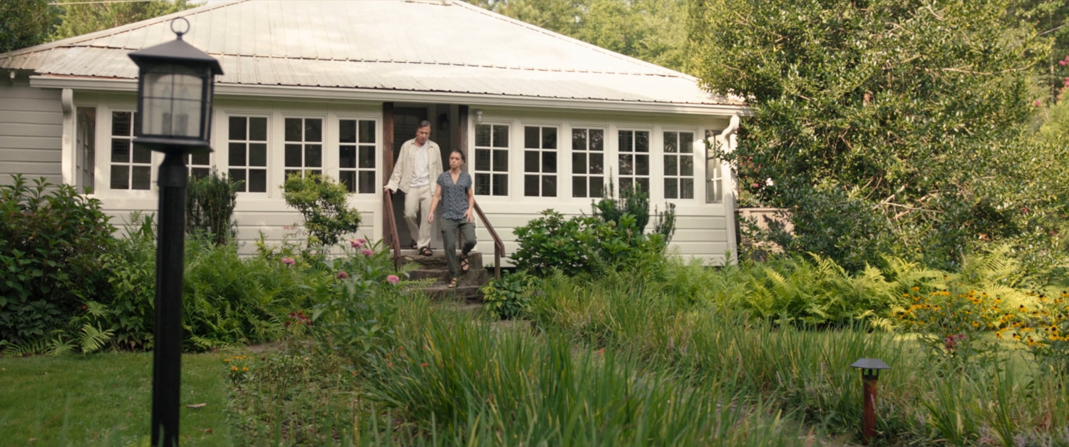 Jen Walters and Emil Blonsky exit a house at the Summer Twilights retreat.