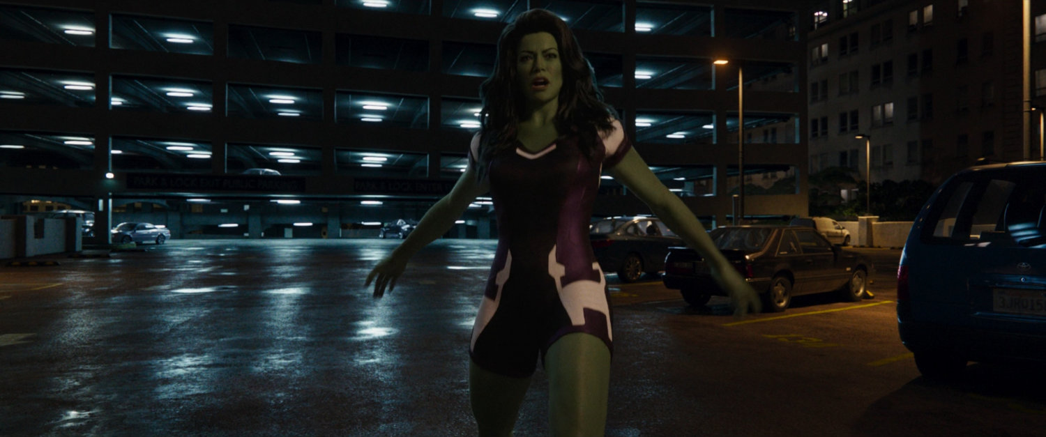 She-Hulk make a thunderclap in a parking lot.