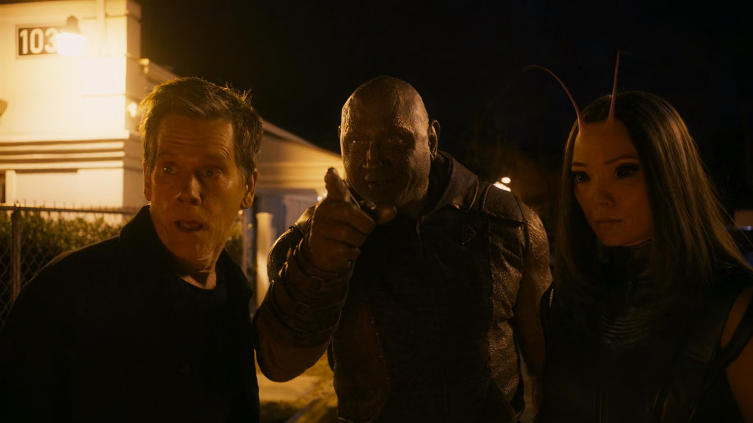 Drax points something out to Kevin Bacon.
