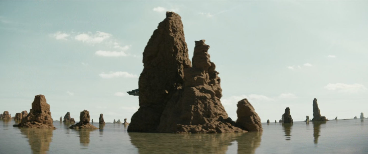 Island rock formations in shallow water.