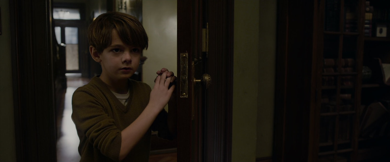 A young Peter Parker explores his parents house.