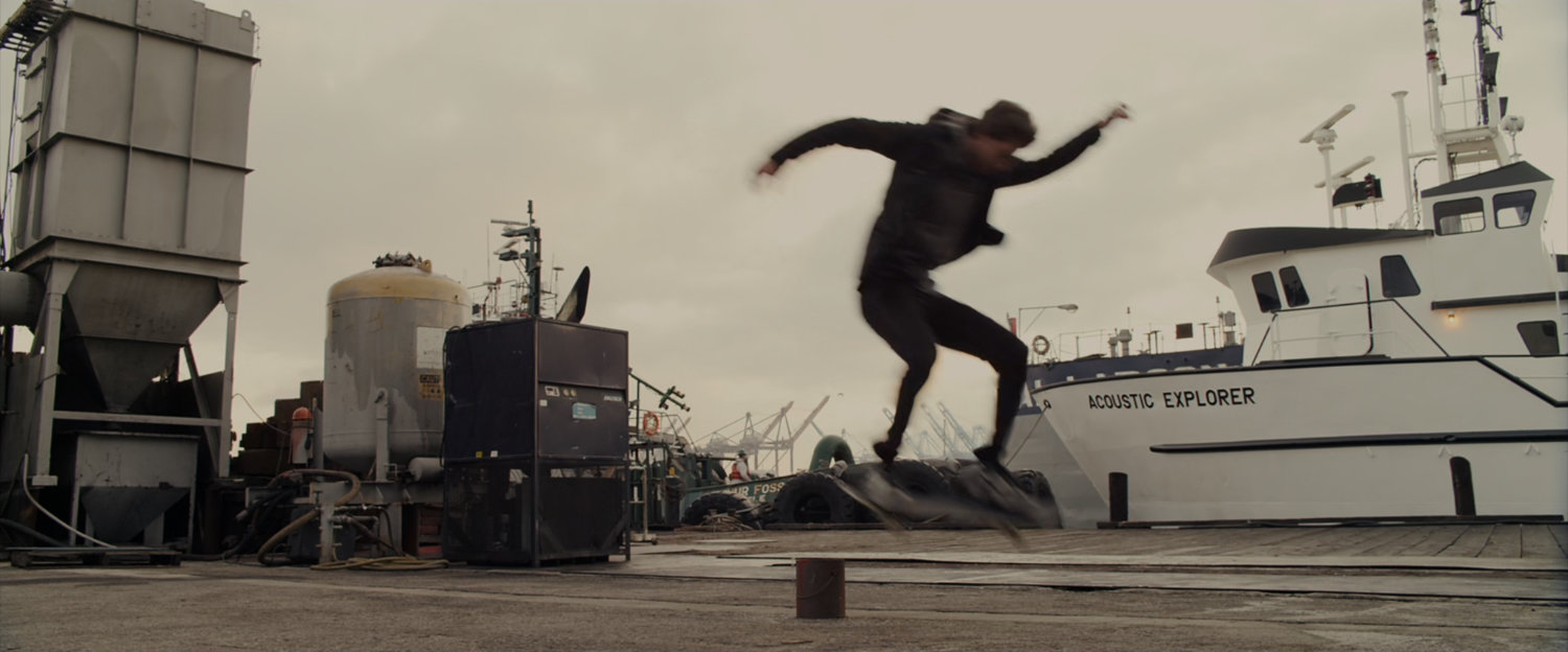 Peter Parker practices skateboarding at the marina.