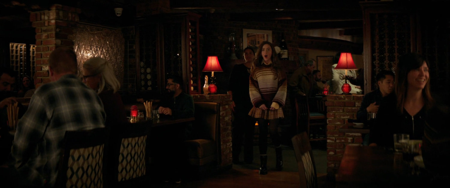Cassie Lang surprised in a fancy restaurant.