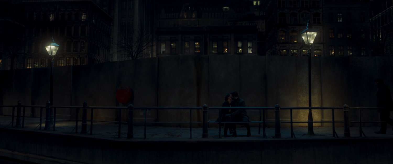 A couple on a park bench by Moscow river.