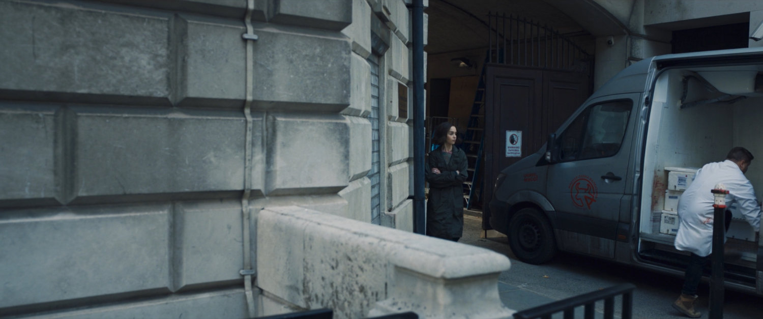 G'iah watching a man load up a van outside a Moscow building.