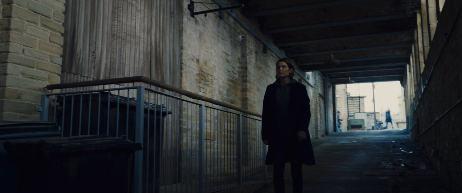 Maria Hill descends a ramp towards a Moscow subway tunnel.