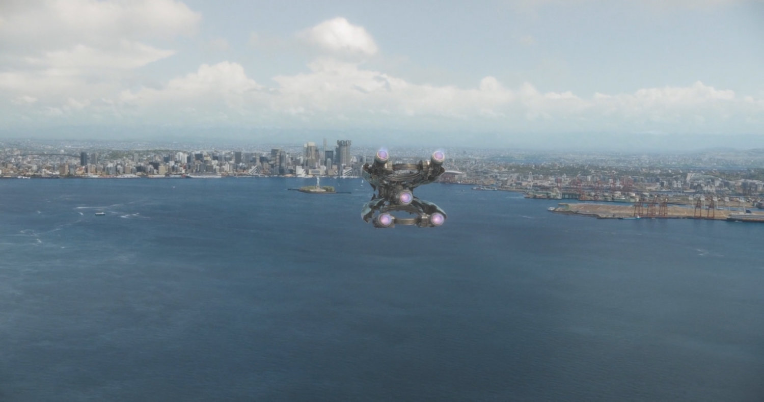 The Bowie flies above Counter-Earth city and harbor.
