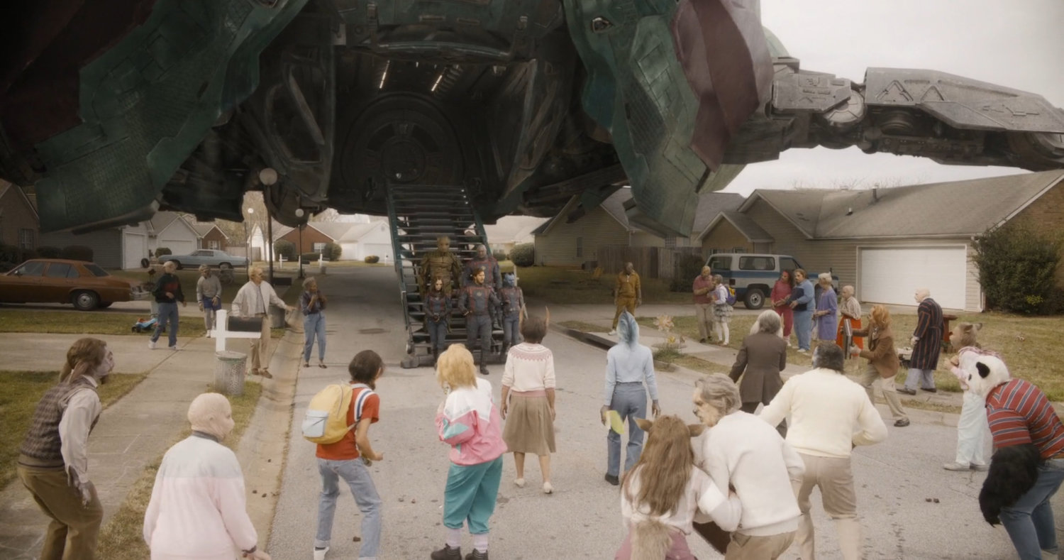 Humanimals surround the Guardians of the Galaxy on a suburban street.