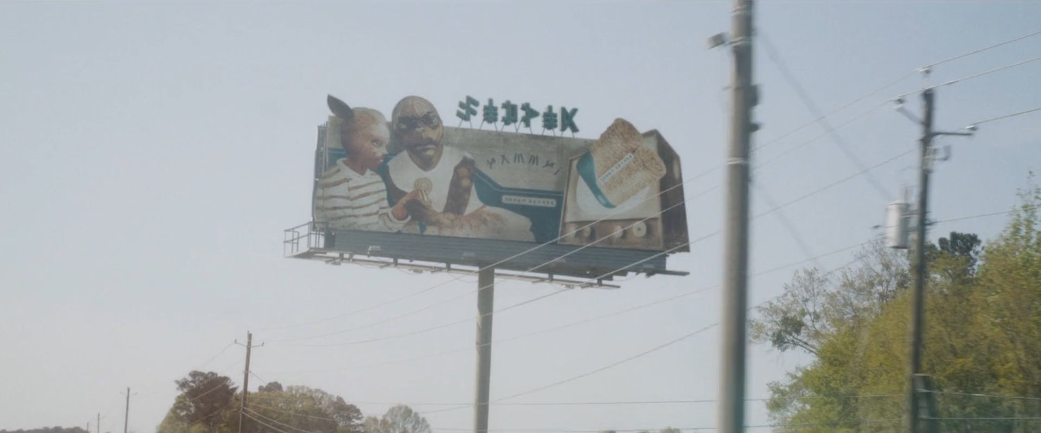 An alien billboard on a Counter-Earth highway.
