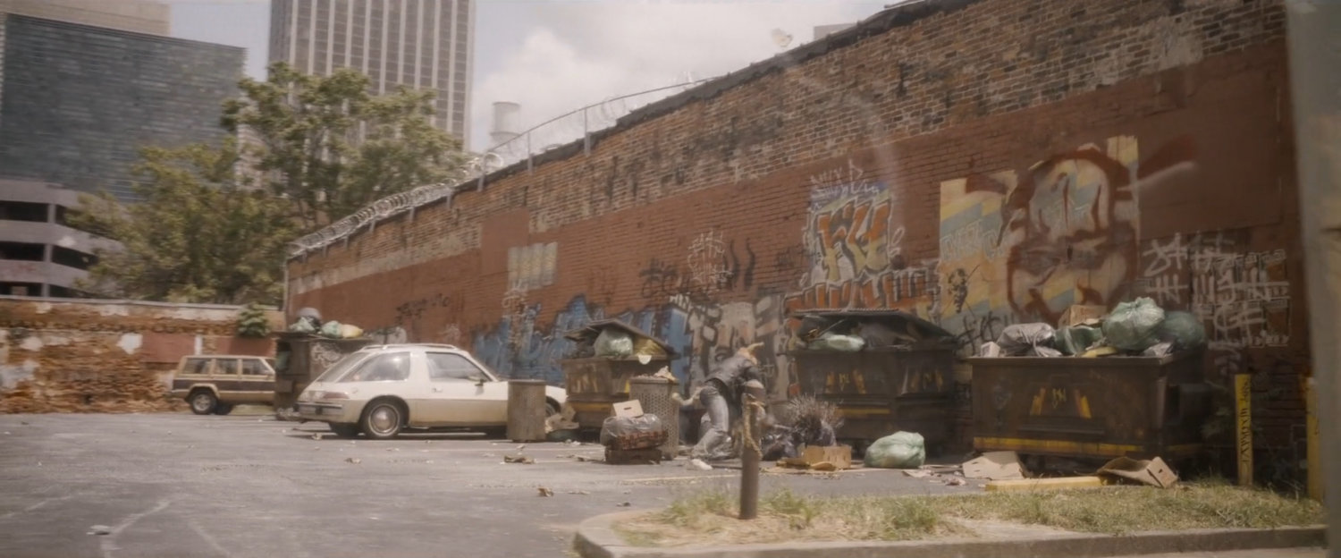 One humanimal beats up on another in a Counter-Earth parking lot.