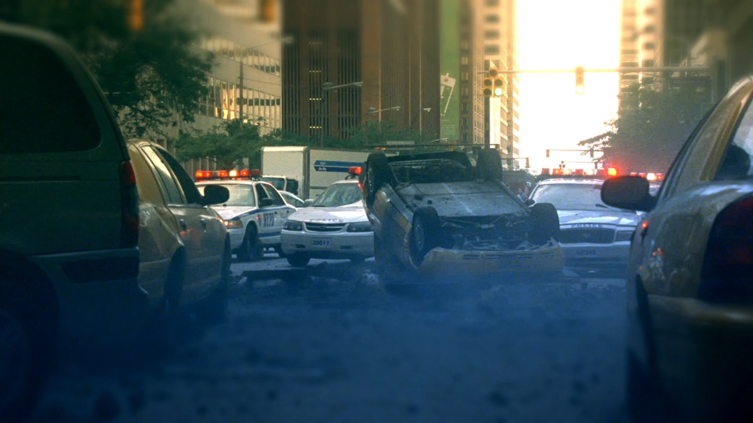 Wrecked cars in New York City street.