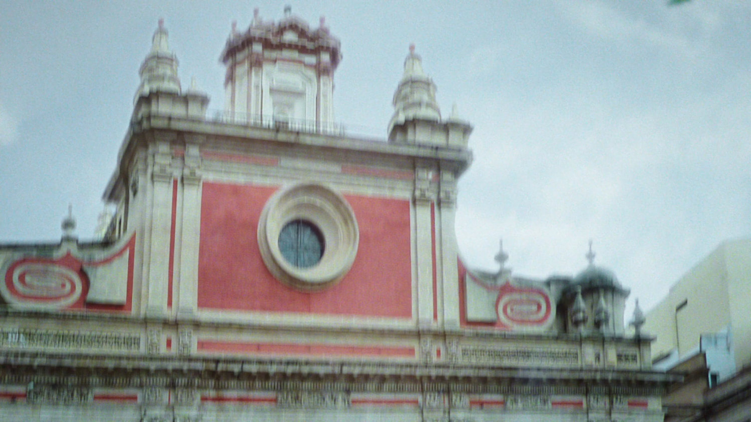 Slightly blurry shot of top of church in Plaza Salvador, Seville.