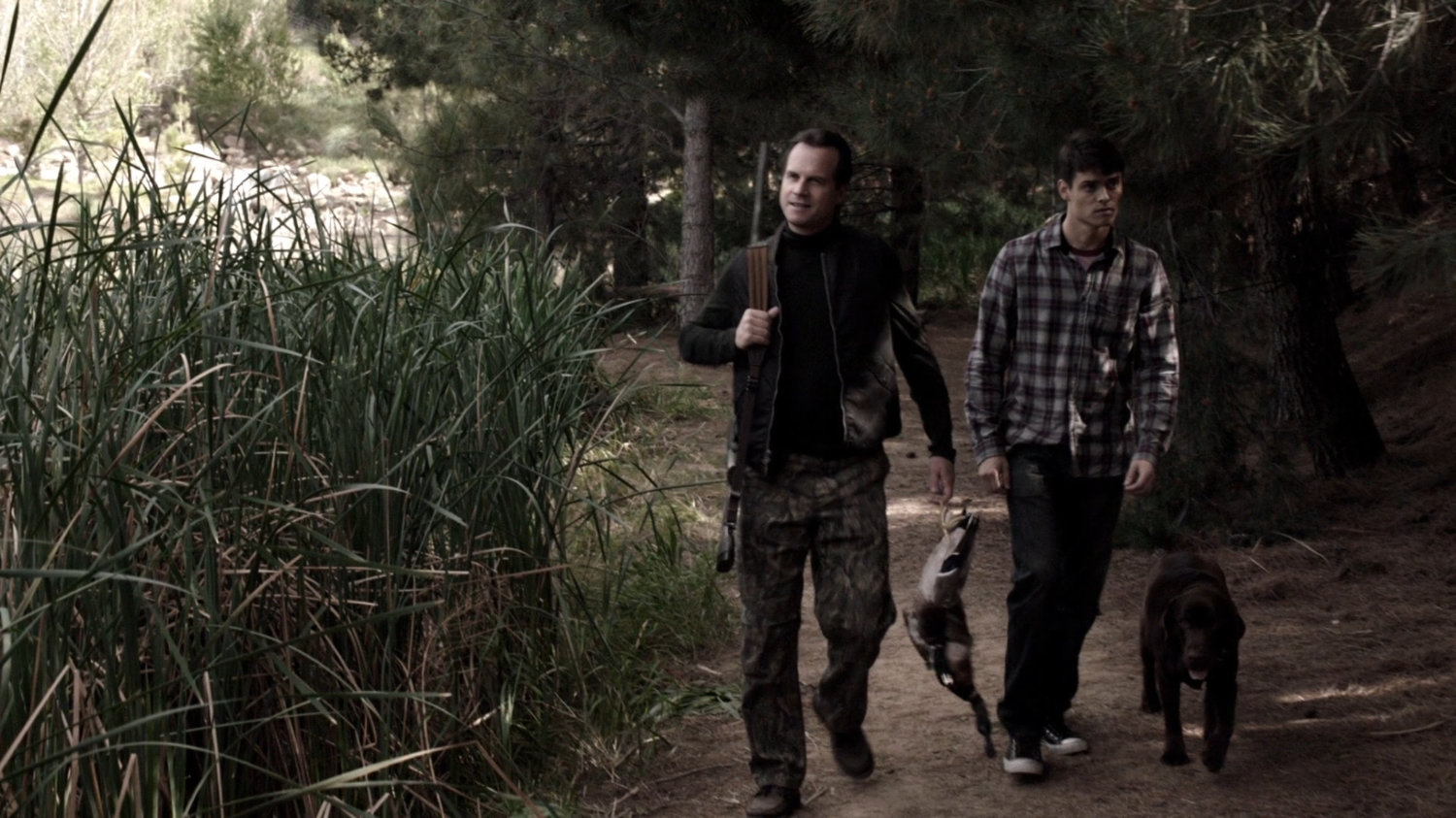 John Garrett and young Grant Ward in the woods of Wyoming.
